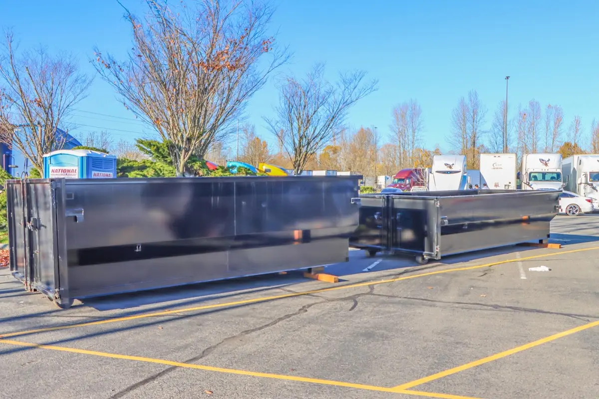 Professional dumpster rental service with roll-off container on residential driveway in Libertyville